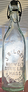 J. B. LOSTY BREWERY EMBOSSED BEER BOTTLE