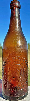 SPRING GARDEN BREWERY BOTTLING DEPARTMENT EMBOSSED BEER BOTTLE