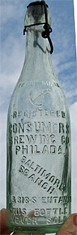 CONSUMERS BREWING COMPANY EMBOSSED BEER BOTTLE