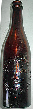 MONUMENTAL BREWING COMPANY EMBOSSED BEER BOTTLE