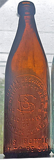 ORIENTAL BREWING COMPANY EMBOSSED BEER BOTTLE