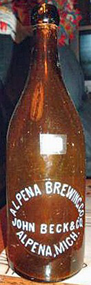 ALPENA BREWING COMPANY EMBOSSED BEER BOTTLE