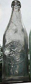 AMERICAN BREWING COMPANY EMBOSSED BEER BOTTLE