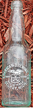 AMERICAN BREWING COMPANY EMBOSSED BEER BOTTLE