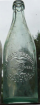 AMERICAN BREWING COMPANY EMBOSSED BEER BOTTLE