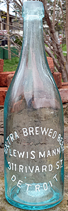 LEWIS MANN EXTRA BREWED BEER EMBOSSED BEER BOTTLE