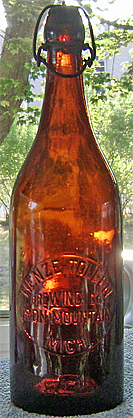 HENZE TOLLEN BREWING COMPANY EMBOSSED BEER BOTTLE