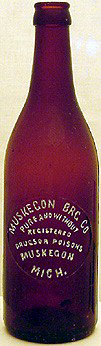 MUSKEGON BREWING COMPANY EMBOSSED BEER BOTTLE