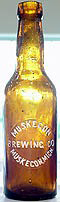 MUSKEGON BREWING COMPANY EMBOSSED BEER BOTTLE