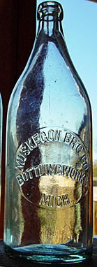 MUSKEGON BREWING COMPANY BOTTLING WORKS EMBOSSED BEER BOTTLE