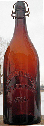 MUSKEGON BREWING COMPANY BOTTLING WORKS EMBOSSED BEER BOTTLE