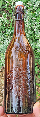 MUSKEGON BREWING COMPANY EMBOSSED BEER BOTTLE