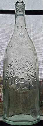 MUSKEGON BREWING COMPANY EMBOSSED BEER BOTTLE