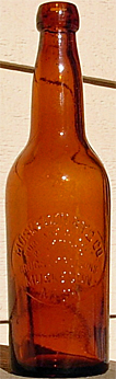 MUSKEGON BREWING COMPANY EMBOSSED BEER BOTTLE