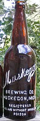 MUSKEGON BREWING COMPANY EMBOSSED BEER BOTTLE