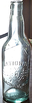 NATIONAL BREWING COMPANY EMBOSSED BEER BOTTLE