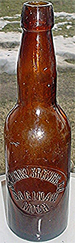 SAGINAW BREWING COMPANY EMBOSSED BEER BOTTLE