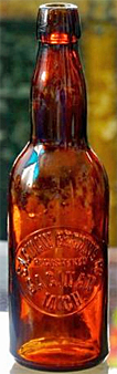 SAGINAW BREWING COMPANY EMBOSSED BEER BOTTLE