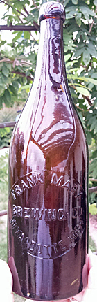 FRANK MARX BREWING COMPANY EMBOSSED BEER BOTTLE