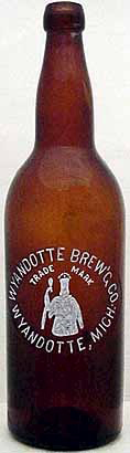 WYANDOTTE BREWING COMPANY EMBOSSED BEER BOTTLE