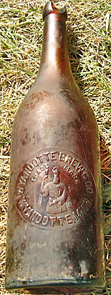 WYANDOTTE BREWING COMPANY EMBOSSED BEER BOTTLE