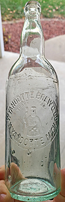 WYANDOTTE BREWING COMPANY EMBOSSED BEER BOTTLE