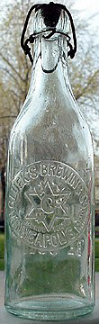 GLUEK'S BREWING COMPANY EMBOSSED BEER BOTTLE