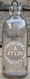 LION BREWING & BOTTLING COMPANY EMBOSSED BEER BOTTLE