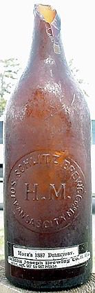 JOSEPH SCHLITZ BREWING COMPANY EMBOSSED BEER BOTTLE