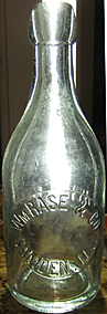 WILLIAM RASE & COMPANY WEISS BEER EMBOSSED BEER BOTTLE