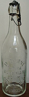 M. BYRNE EXTRA BOHEMIAN BEER EMBOSSED BEER BOTTLE