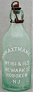 JOHN AXTMANN'S WEISS BEER EMBOSSED BEER BOTTLE