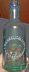 MICHAELIS & LOEWE WEISS BEER EMBOSSED BEER BOTTLE