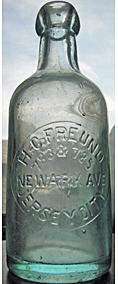 H. C. FREUND WEISS BEER EMBOSSED BEER BOTTLE