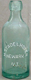 M. STADELHOFER WEISS BEER EMBOSSED BEER BOTTLE