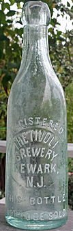 THE TIVOLI BREWERY EMBOSSED BEER BOTTLE