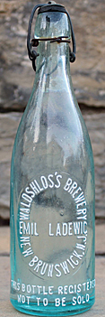 EMIL LADEWIG WALDSCHLOSS BREWERY EMBOSSED BEER BOTTLE