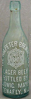 THE WILLIAM PETER BREWING COMPANY EMBOSSED BEER BOTTLE