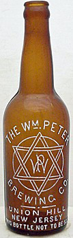 THE WILLIAM PETER BREWING COMPANY EMBOSSED BEER BOTTLE