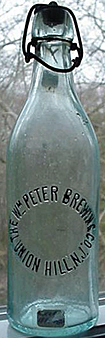 THE WILLIAM PETER BREWING COMPANY EMBOSSED BEER BOTTLE