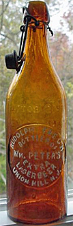 WILLIAM PETER'S EXTRA LAGER BEER EMBOSSED BEER BOTTLE