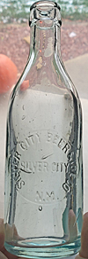 SILVER CITY BEER & ICE COMPANY EMBOSSED BEER BOTTLE