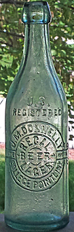 J. M. DONNELLY REGAL LAGER BEER EMBOSSED BEER BOTTLE