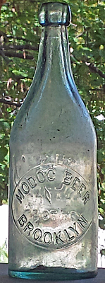 MODOC BEER EMBOSSED BEER BOTTLE