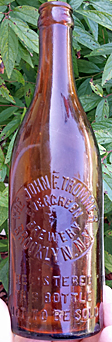 JOHN F. TROMMER EVERGREEN BREWERY EMBOSSED BEER BOTTLE