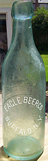 EAGLE BEER COMPANY EMBOSSED BEER BOTTLE