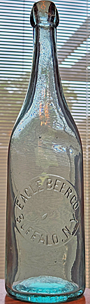 EAGLE BEER COMPANY EMBOSSED BEER BOTTLE