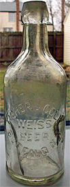 FISHER & COLE WEISS BEER EMBOSSED BEER BOTTLE