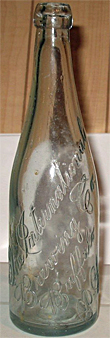 THE INTERNATIONAL BREWING COMPANY EMBOSSED BEER BOTTLE