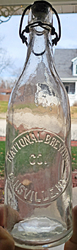 NATIONAL BREWING COMPANY EMBOSSED BEER BOTTLE